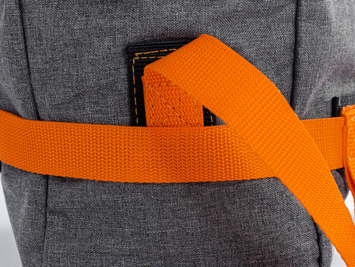 this picture shows the strap connection to the side of the backpack.  This is the bottom part of the backpack where a strap is double stitched and helps secure the side of the roll over top.