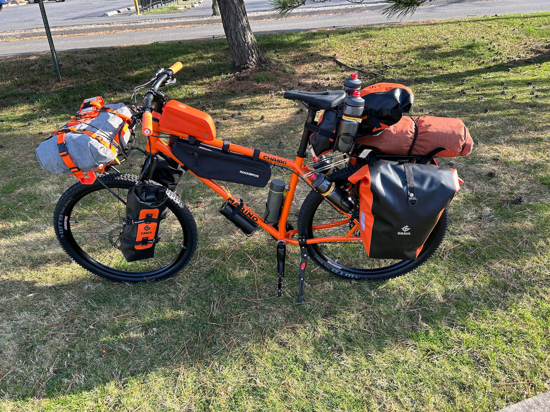Picture of bicycle with Grava Bicycle Bags.  Panniers, Seat pack, Backpack, frame bag, top tube bag, fork bags and handlebar bag