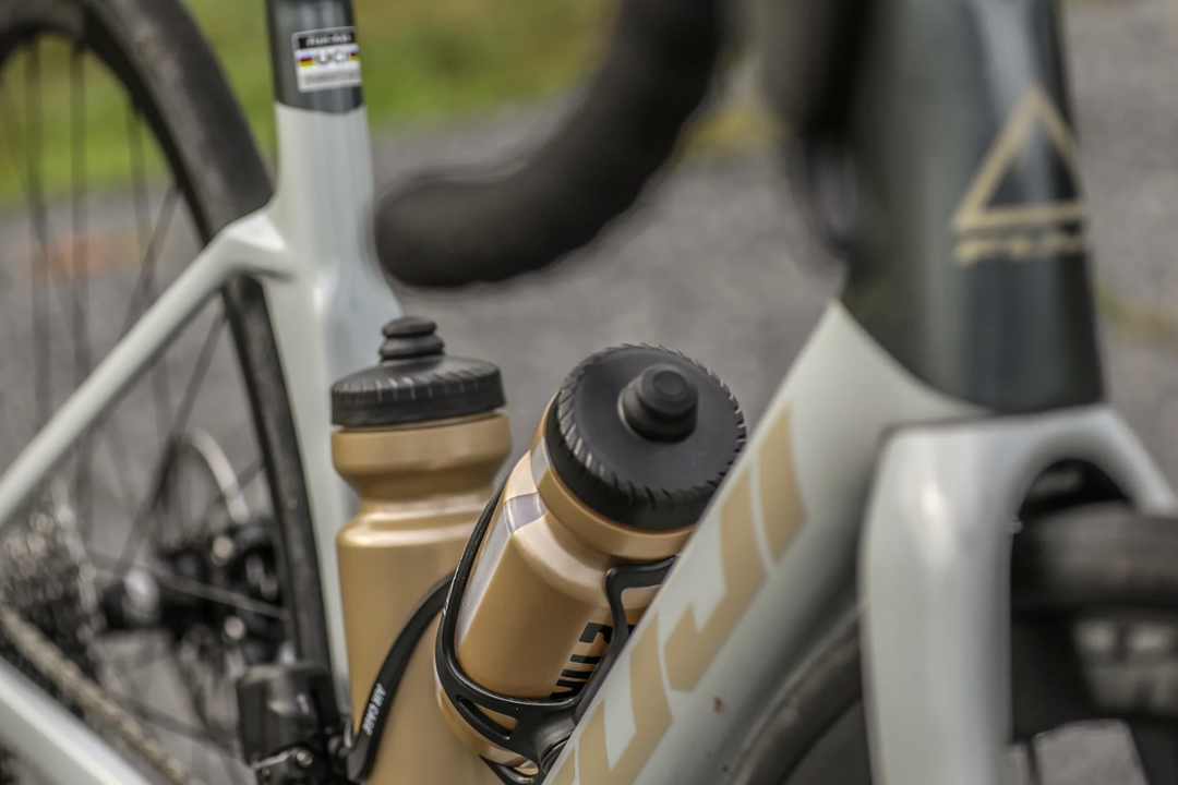 Close-up of a bicycle with water bottles attached on a blurred background