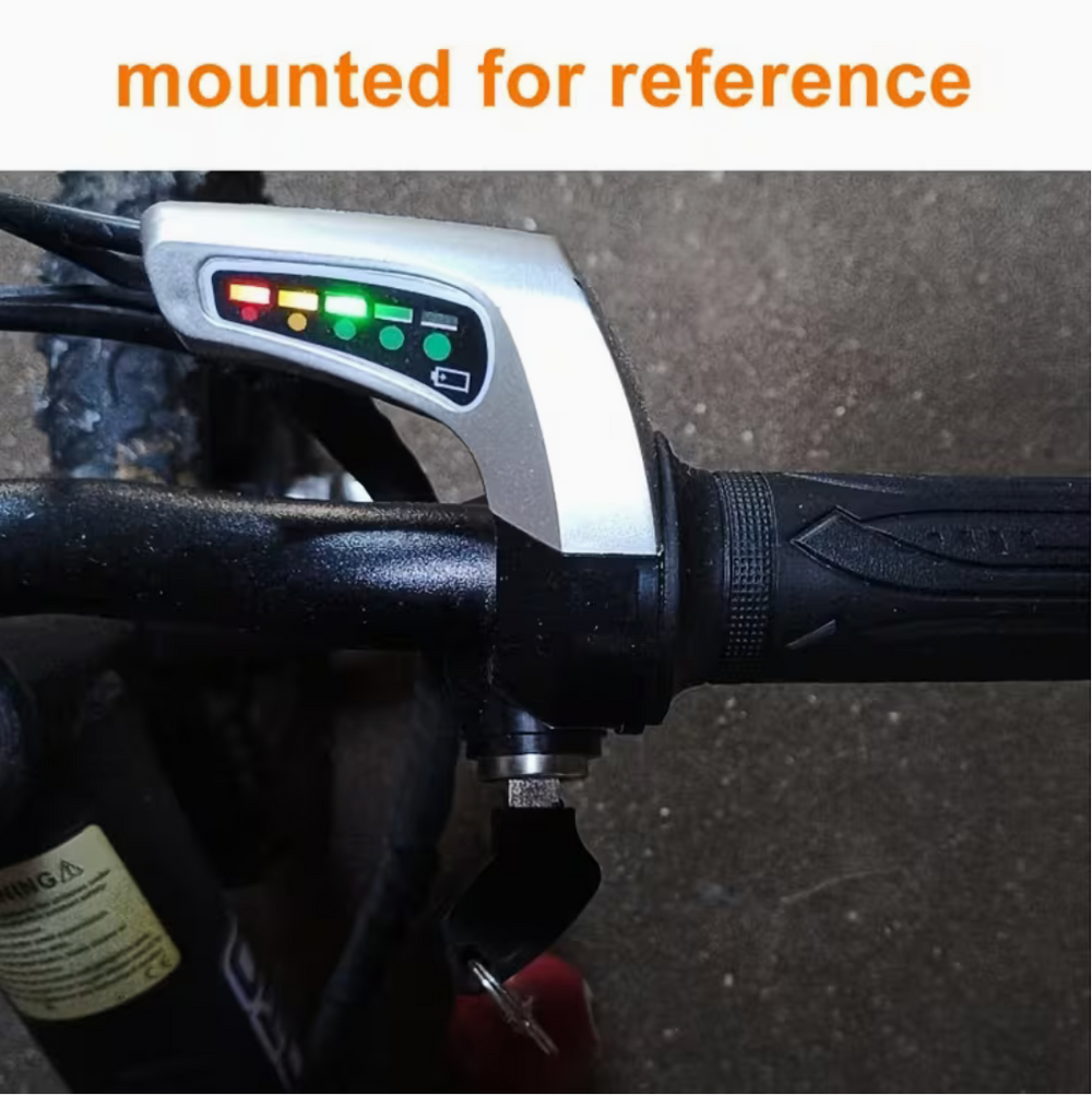 Bike handlebar with a speedometer attached, text 'mounted for reference' at the top.