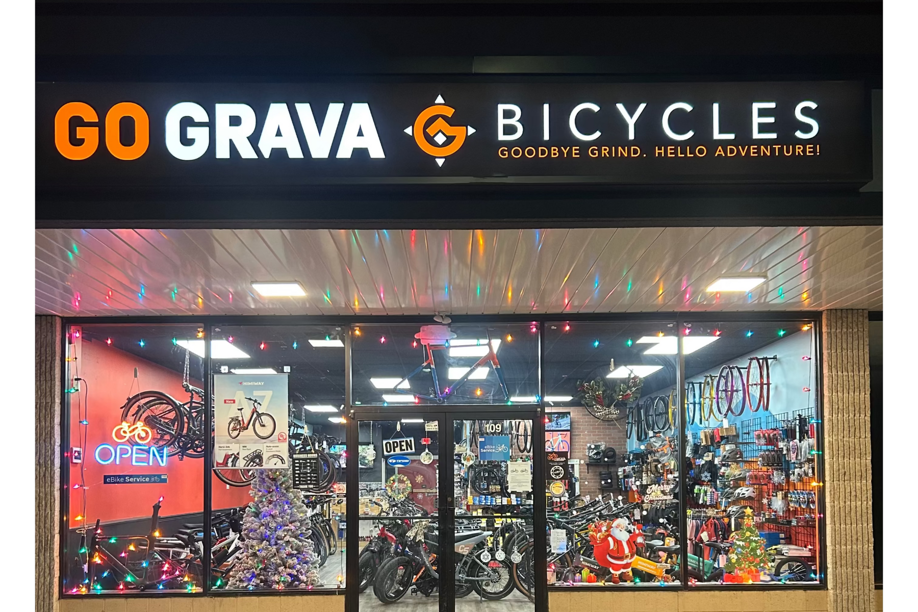 Storefront with 'GO GRAVA BICYCLES' sign and display of bicycles inside.