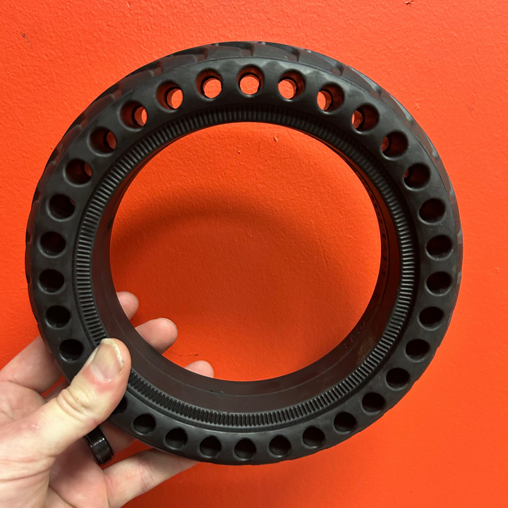 8.5 inch by 2 inch solid scooter tire with perforated holes to help with flexibility.  