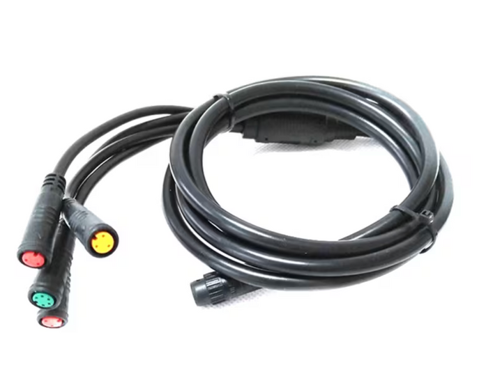 Coiled black cable with colored connectors on a white background
