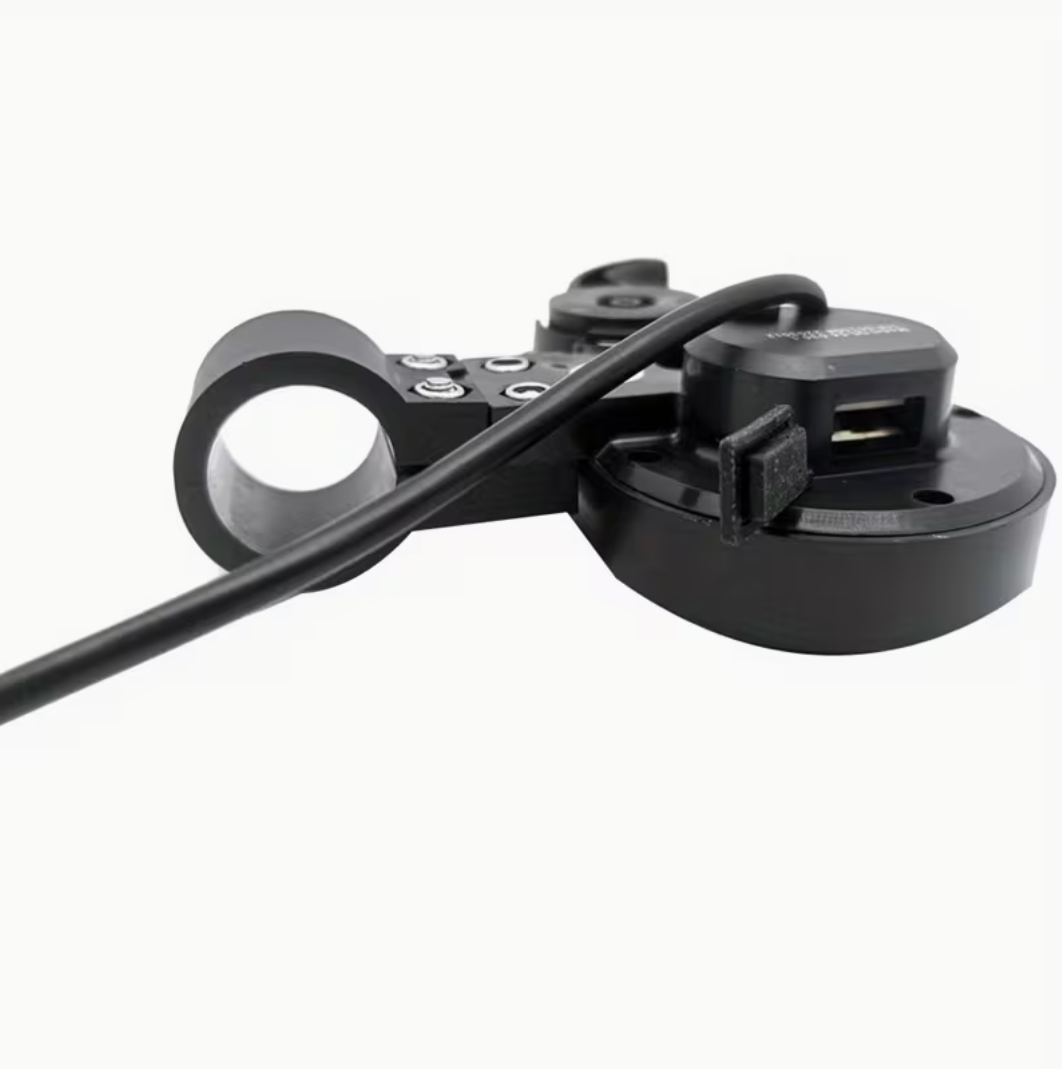Black bike mount with USB port on a white background