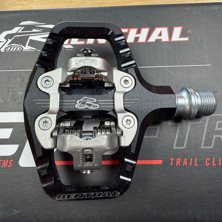 Black and silver pedal on a Renthal branded mat