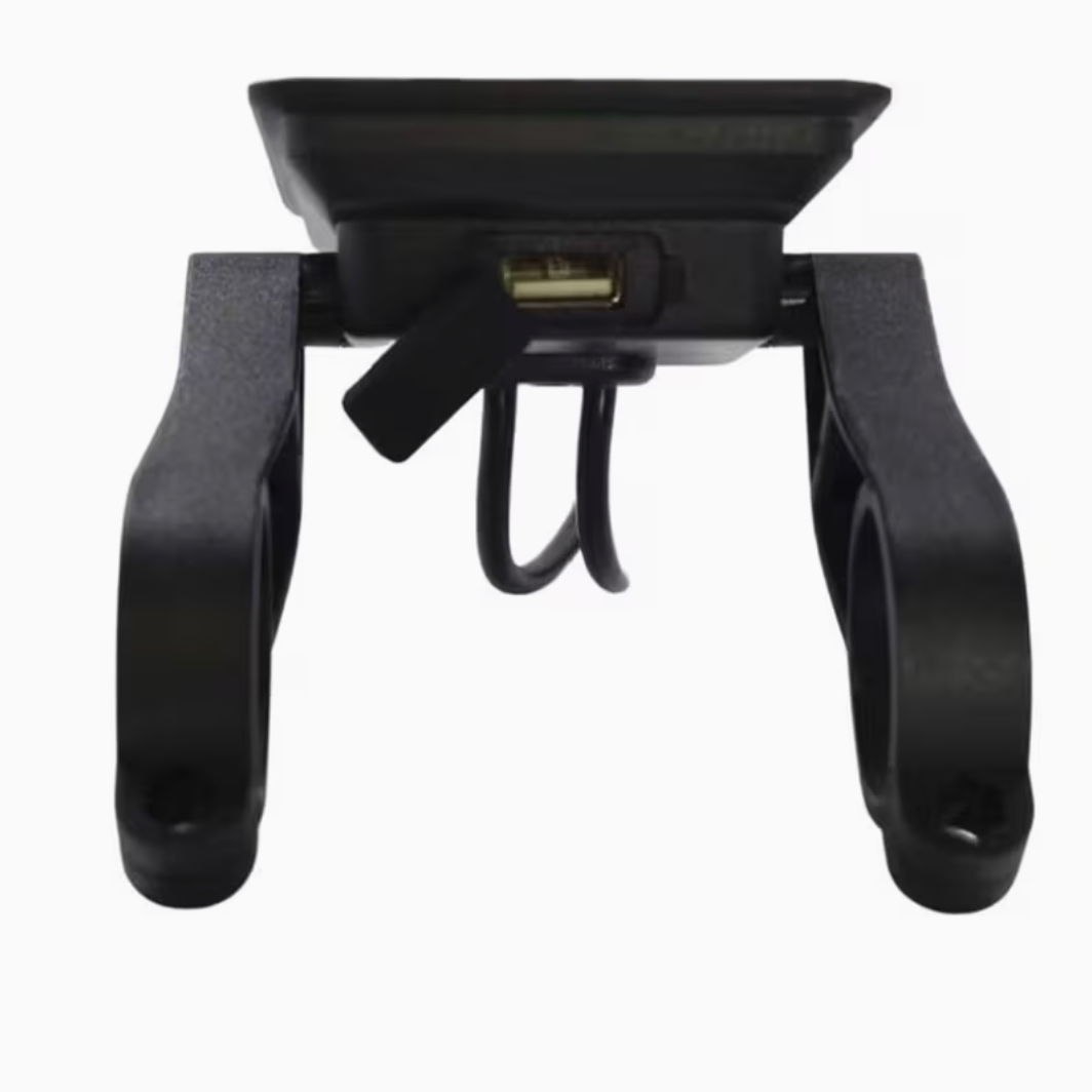 Black plastic tool with a handle and a rectangular component on a white background