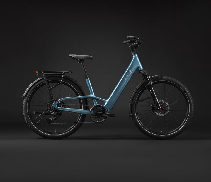 X-LAB ST5+ LS in Aether Sky Blue, original manufacturer studio side view showing the drivetrain, low-step frame and rear rack