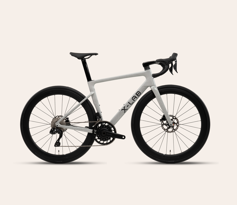X-LAB RS7 Shimano 105 Di2 road bike in Angel Wing White on a pale warm neutral background
