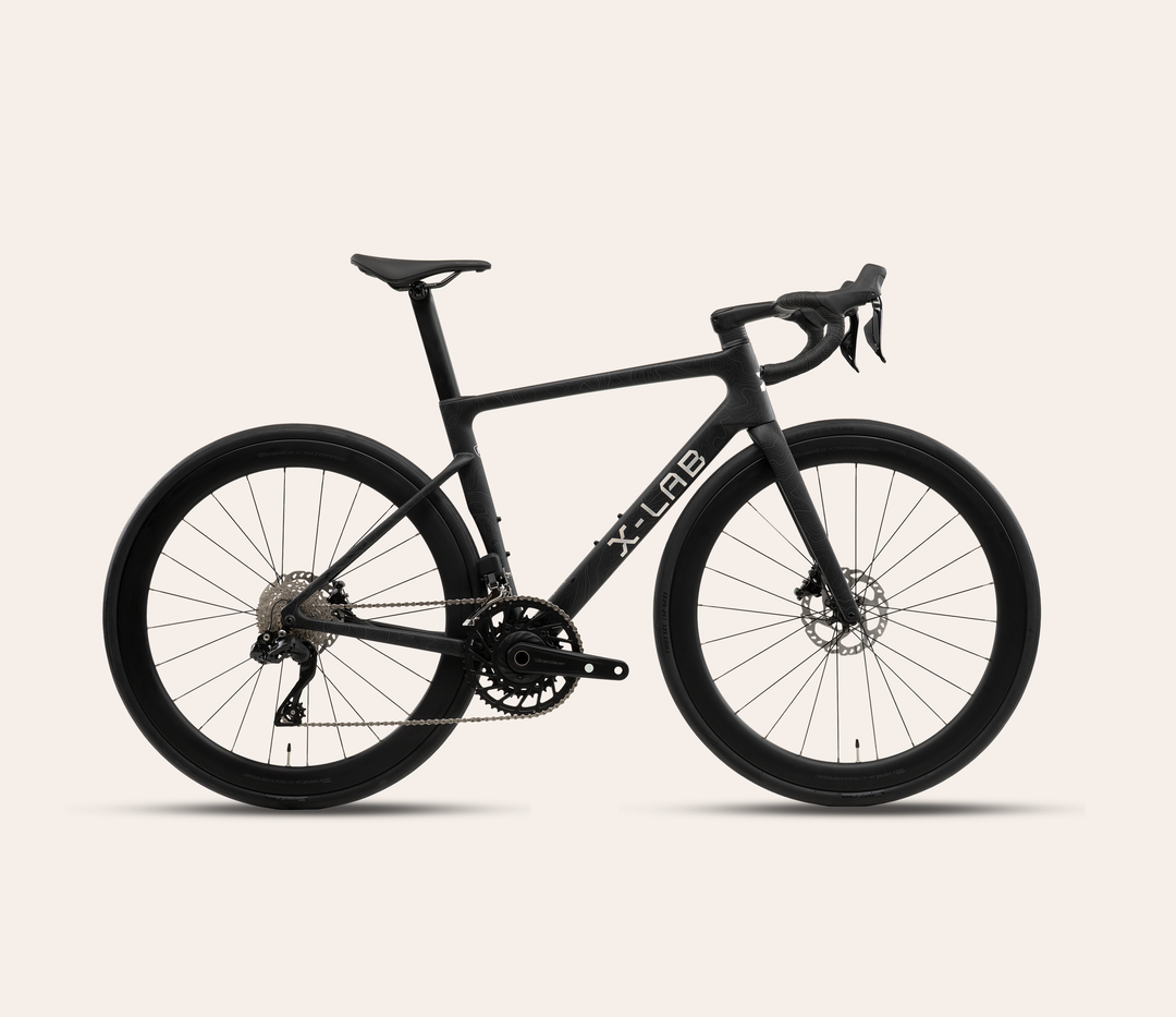 X-LAB RS7 Shimano 105 Di2 road bike in Singularity Black on a pale warm neutral background